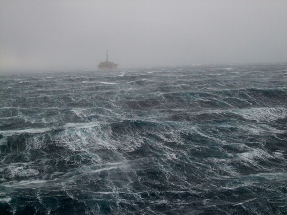 An offshore oil rig amid the choppy waters of the North Sea.