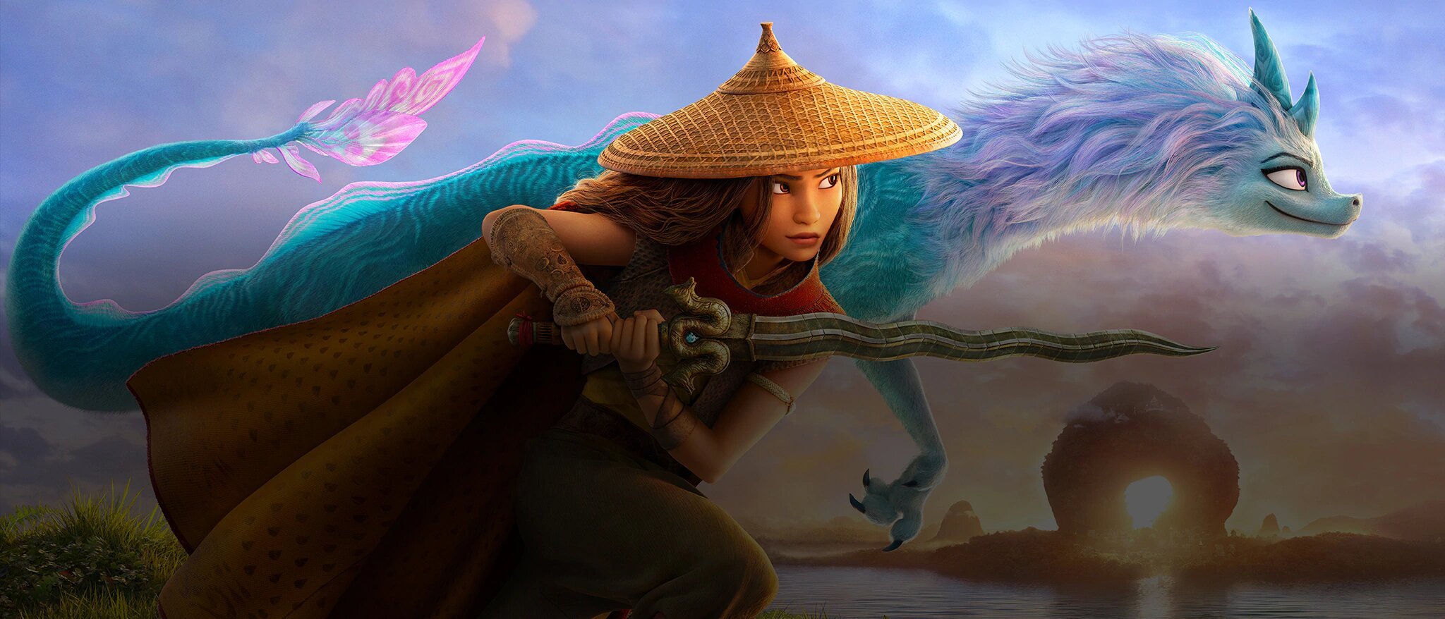 A still from Raya and the Last Dragon, showing a young woman and a blue dragon.