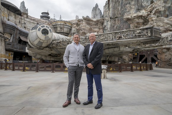 Former Disney CEO Bob Iger and current CEO Bob Chapek at a Disney theme park.