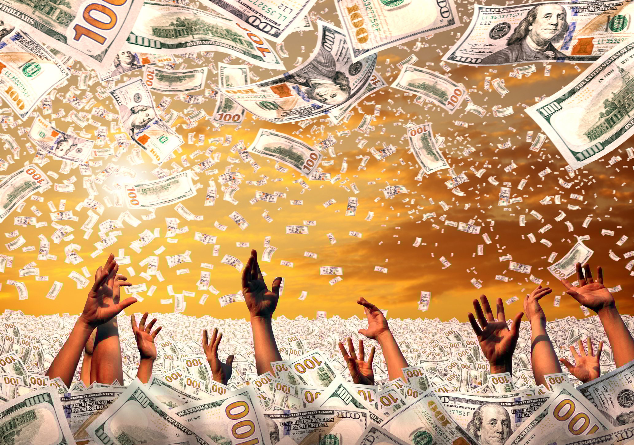 Hands reaching up from a sea of money to grab more money.