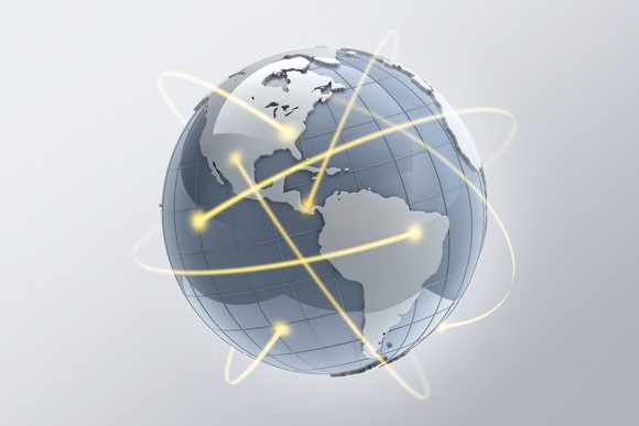 A globe with yellow lines circling around it.