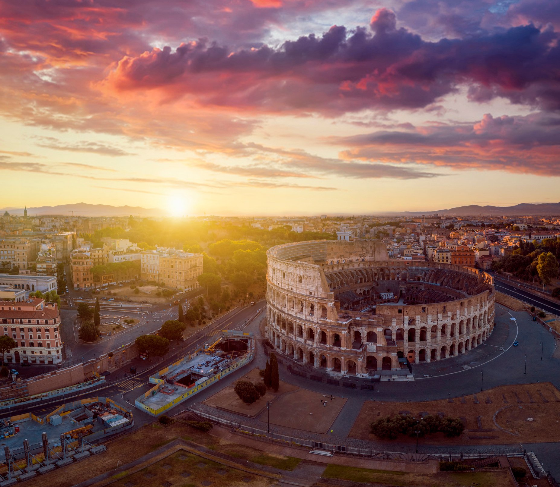 A sun sets over Rome. 