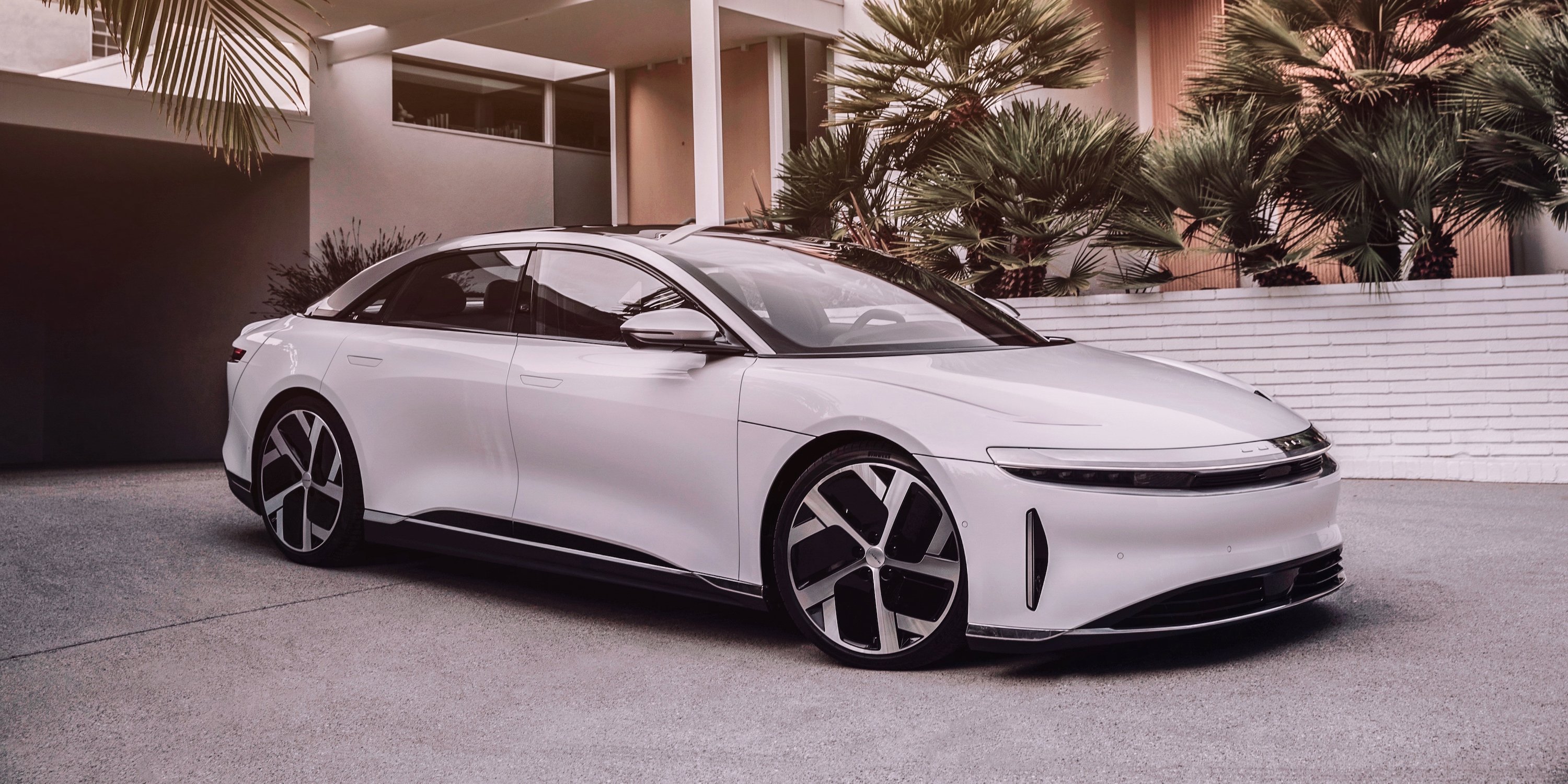 White Lucid Air sedan in a driveway
