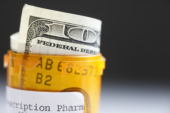 Hundred dollar bill in prescription bottle.