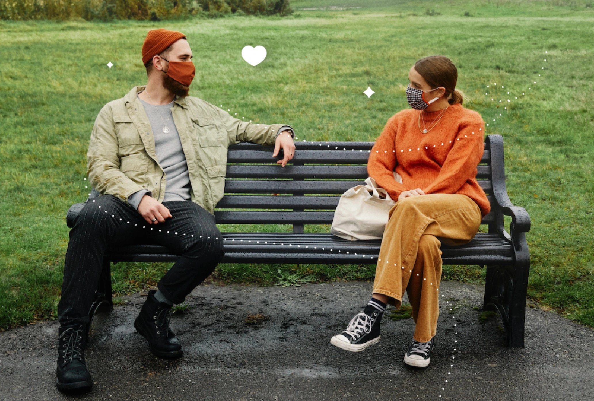 A couple in masks meeting in a park.