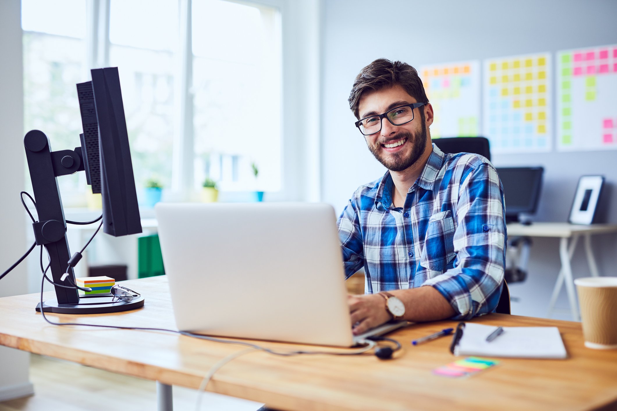 Smiling man at laptop
