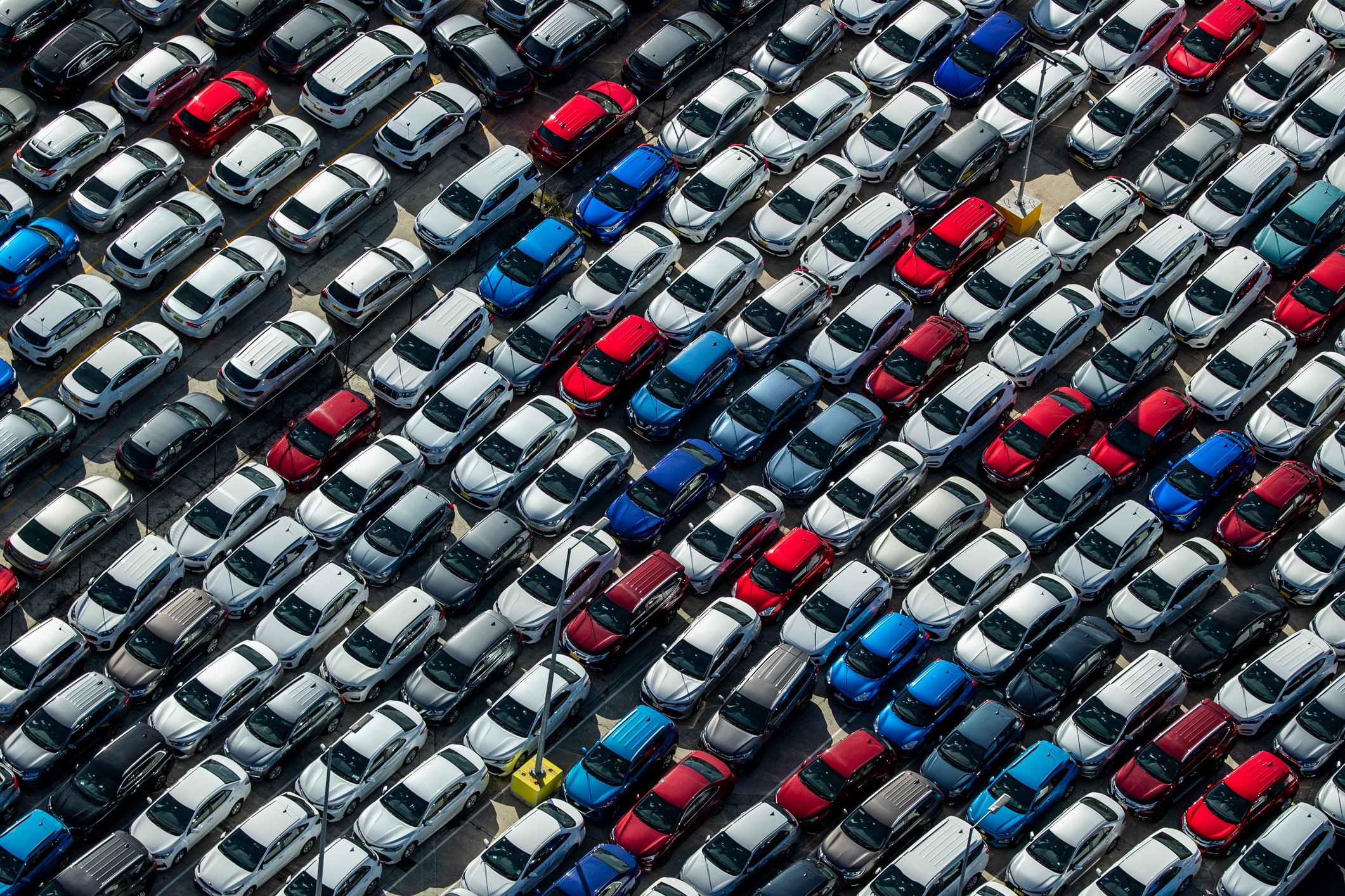 An aerial view of parked cars.