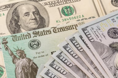 Stimulus check with $100 bills