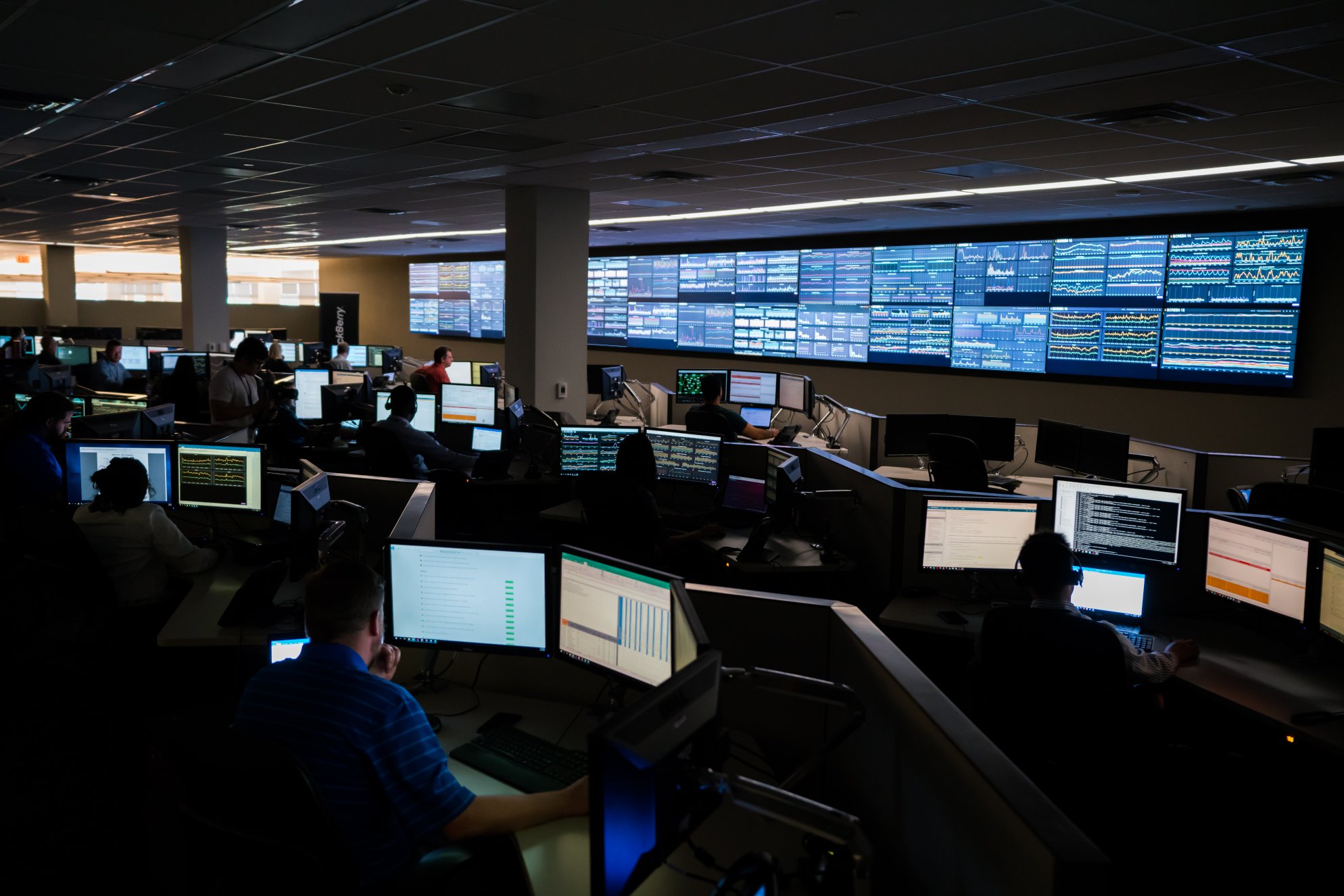 BlackBerry's network operations center, a large room with employees sitting at computers and several large displays on the wall