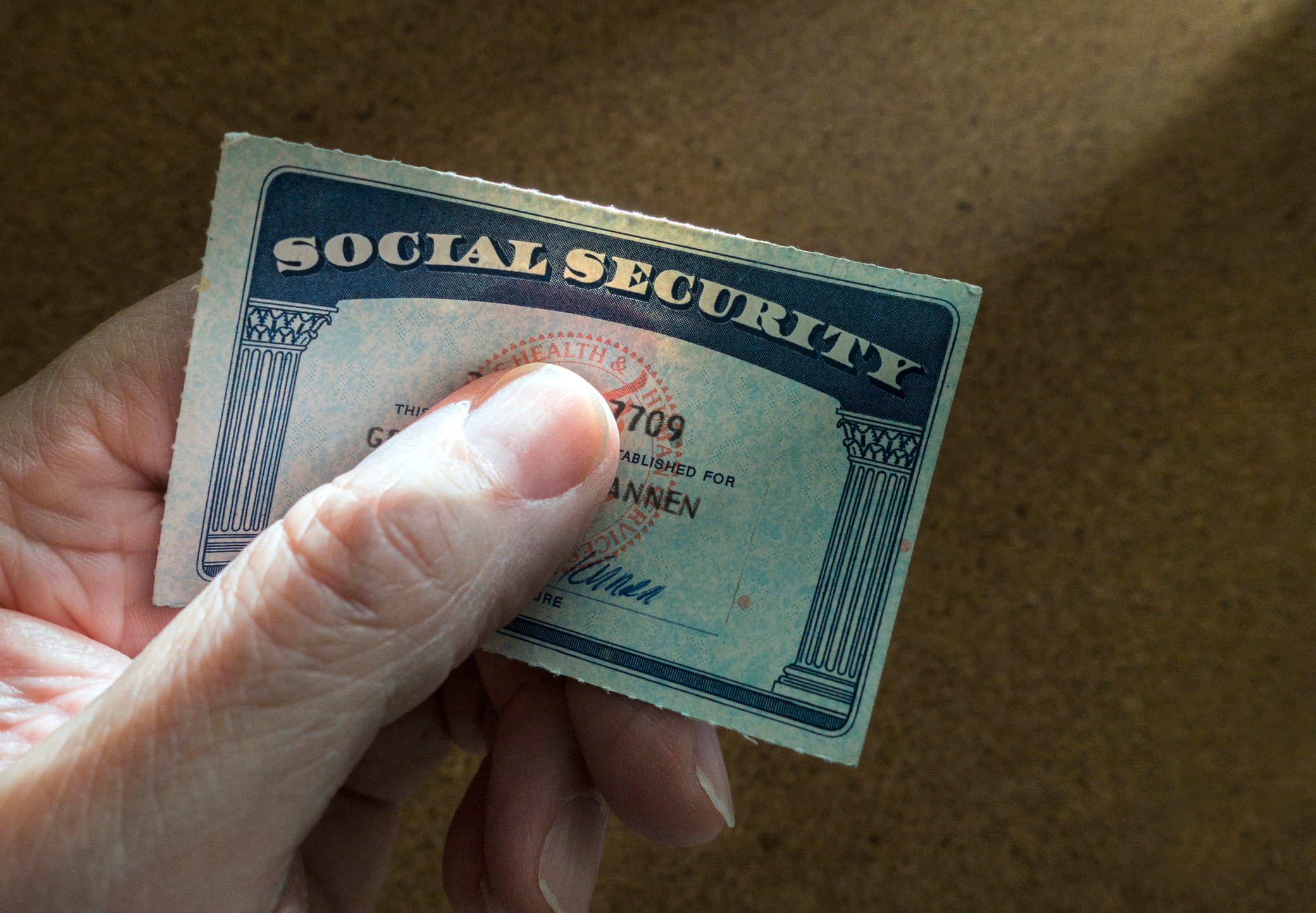 Social Security card in person's hand