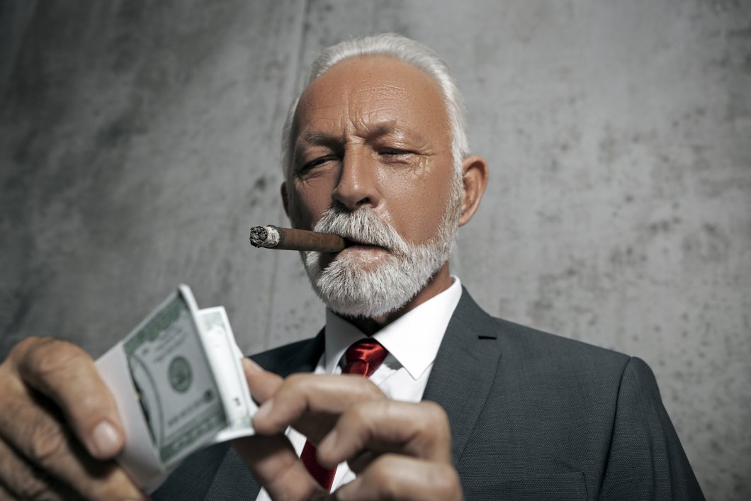 Old billionaire smoking a cigar while counting a stock of $100 bills.