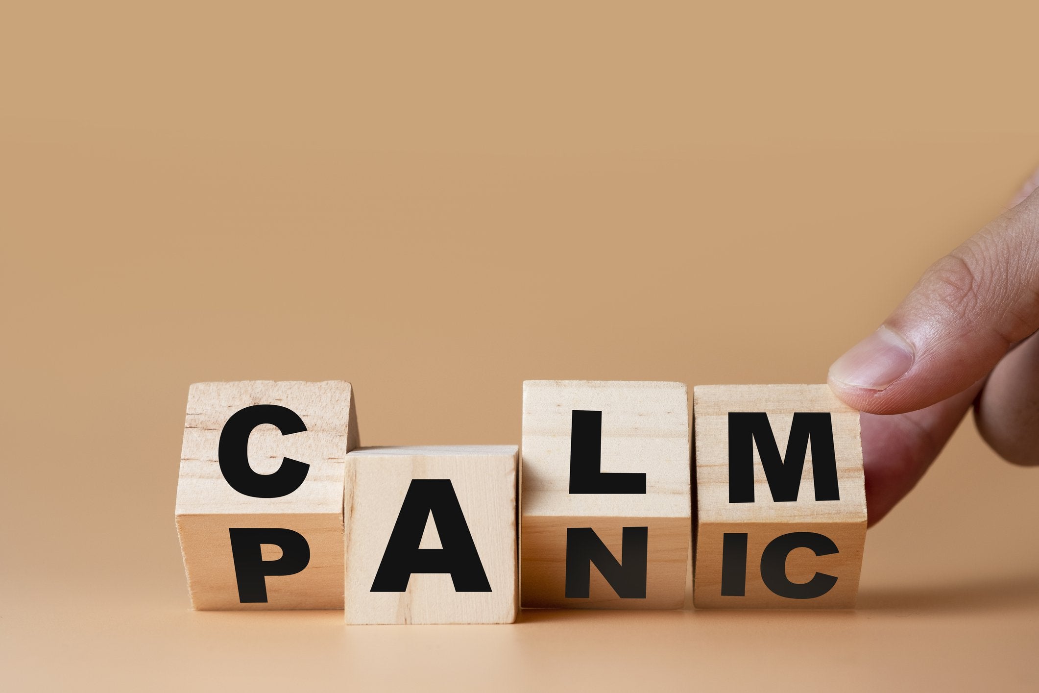 Blocks spelling panic changing to calm.