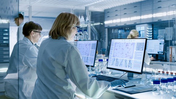 Medical researchers using computers in the lab