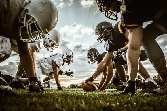 Players lined up at the start of a generic football game.