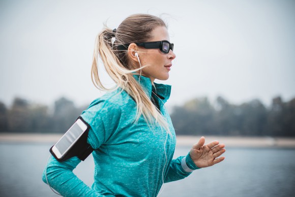 A runner wearing a pair of Vuzix's Blade smartglasses.