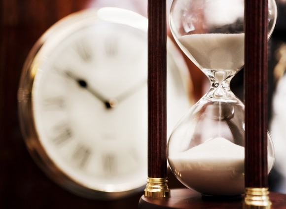 An older clock and an hourglass.
