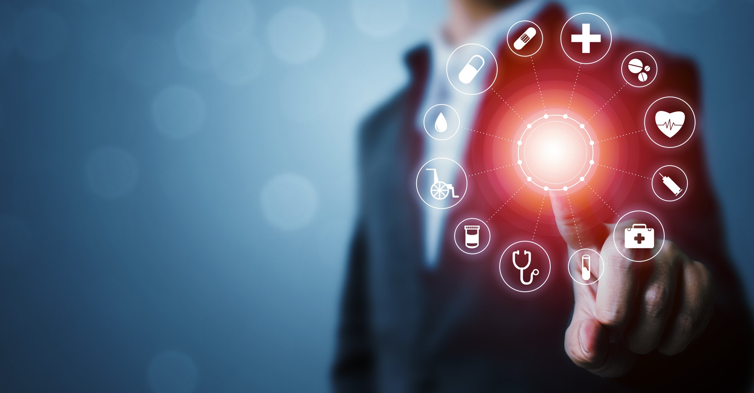 Man pointing to a light with healthcare-related icons arranged in a circle around it