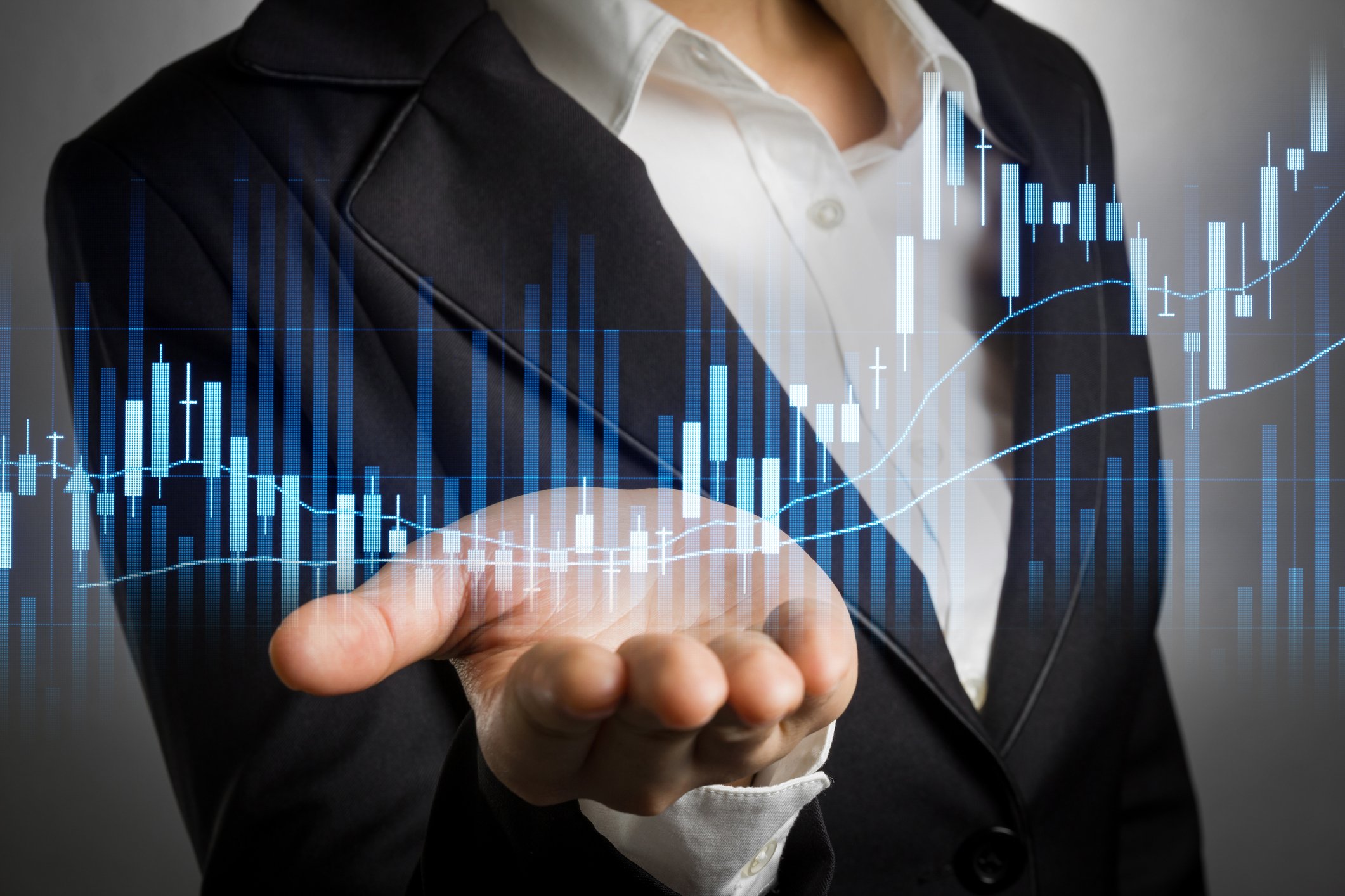 man holding hand out with stock chart rising, showing high daily trading volume