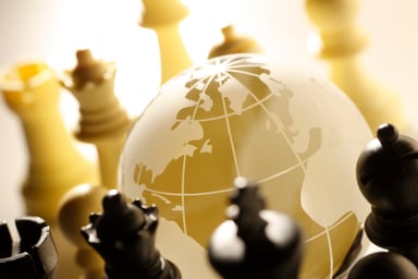 GettyImages-globe and chess pieces