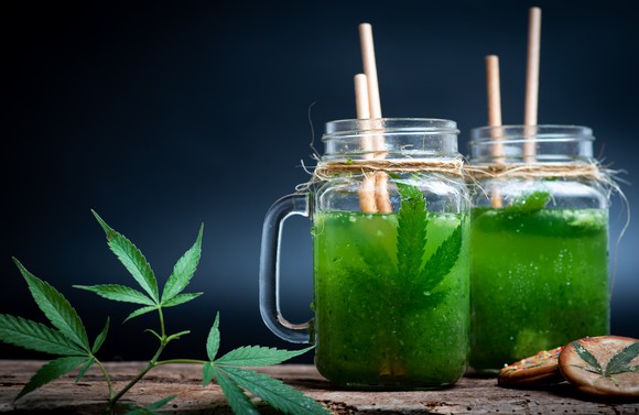 Green smoothies with cannabis leaf in it