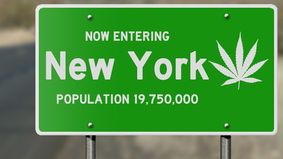 New York state road sign with marijuana leaf and population number.