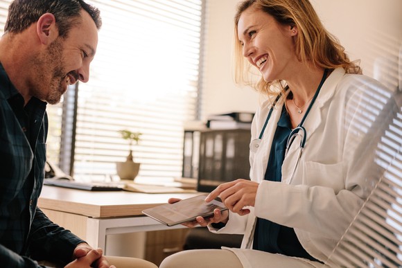 Physician laughing with a patient