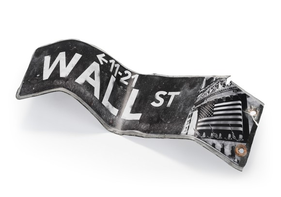A bent Wall Street street sign. 