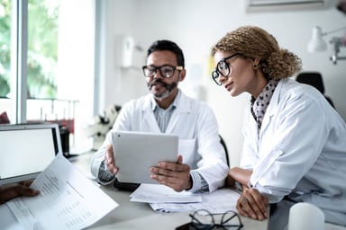 male and female doctor meet in an office