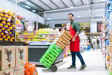 A grocery worker in the produce department