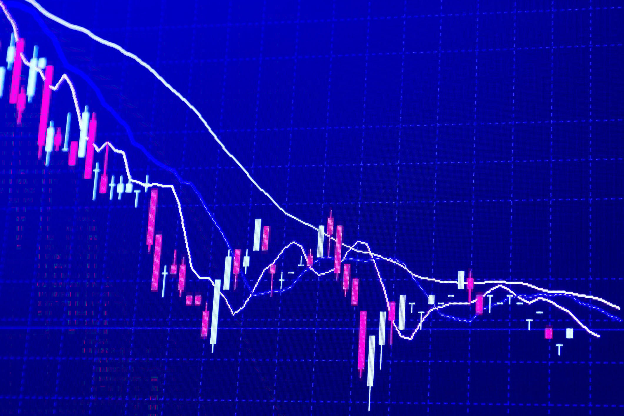 A financial chart shows a down-trending line.