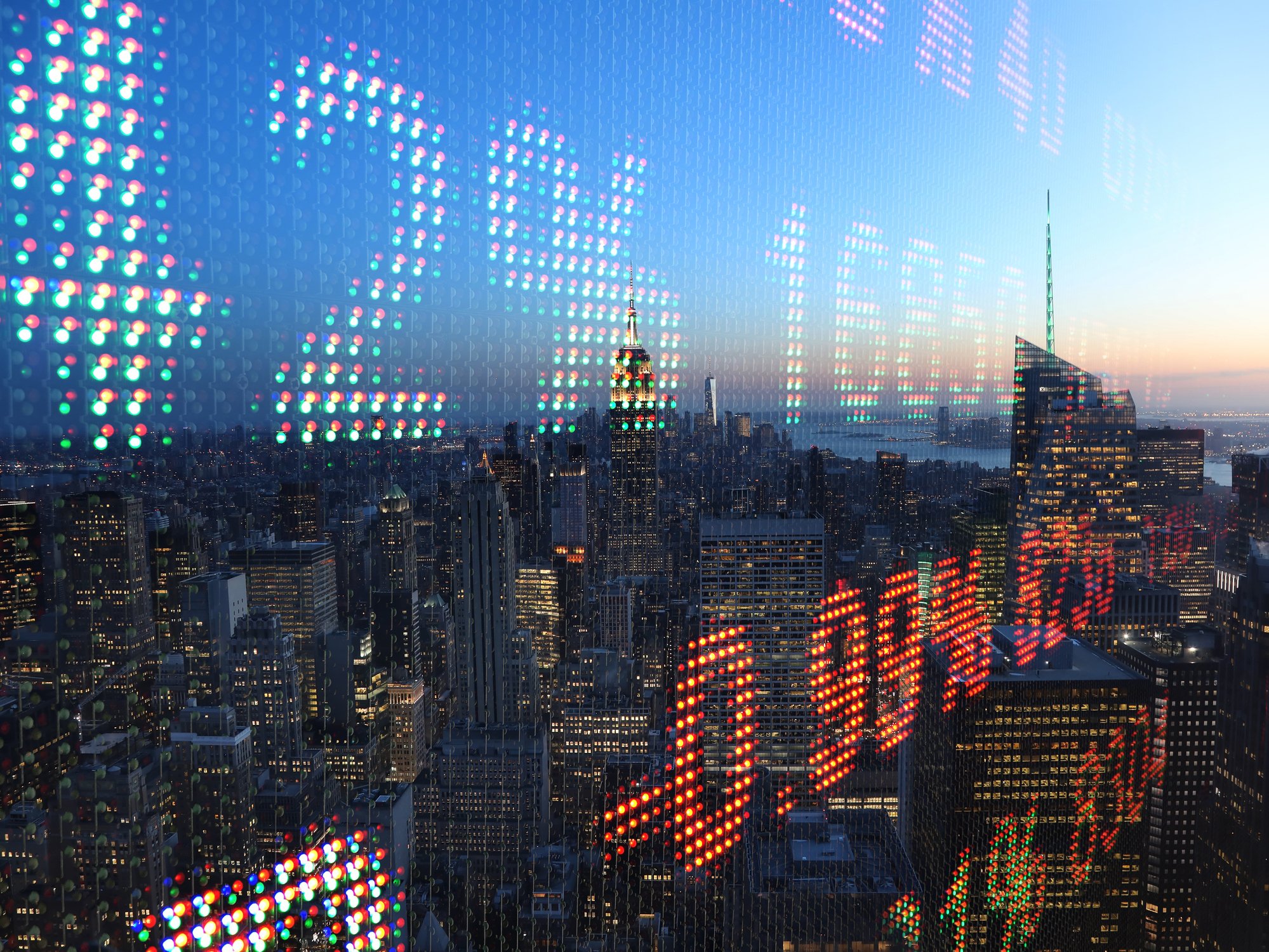 Cityscape overlaid with stock charts