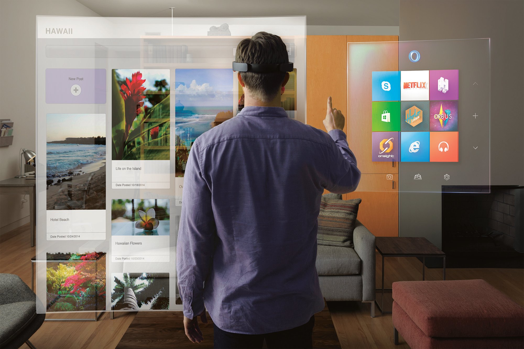 A man uses the HoloLens in his living room.