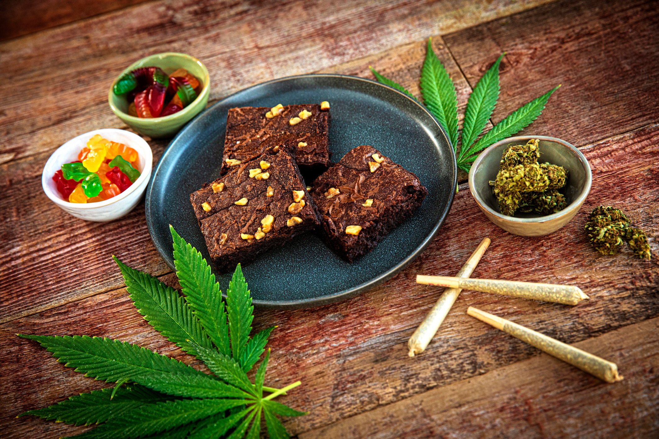 marijuana edibles including gummies and brownies, along with flower buds