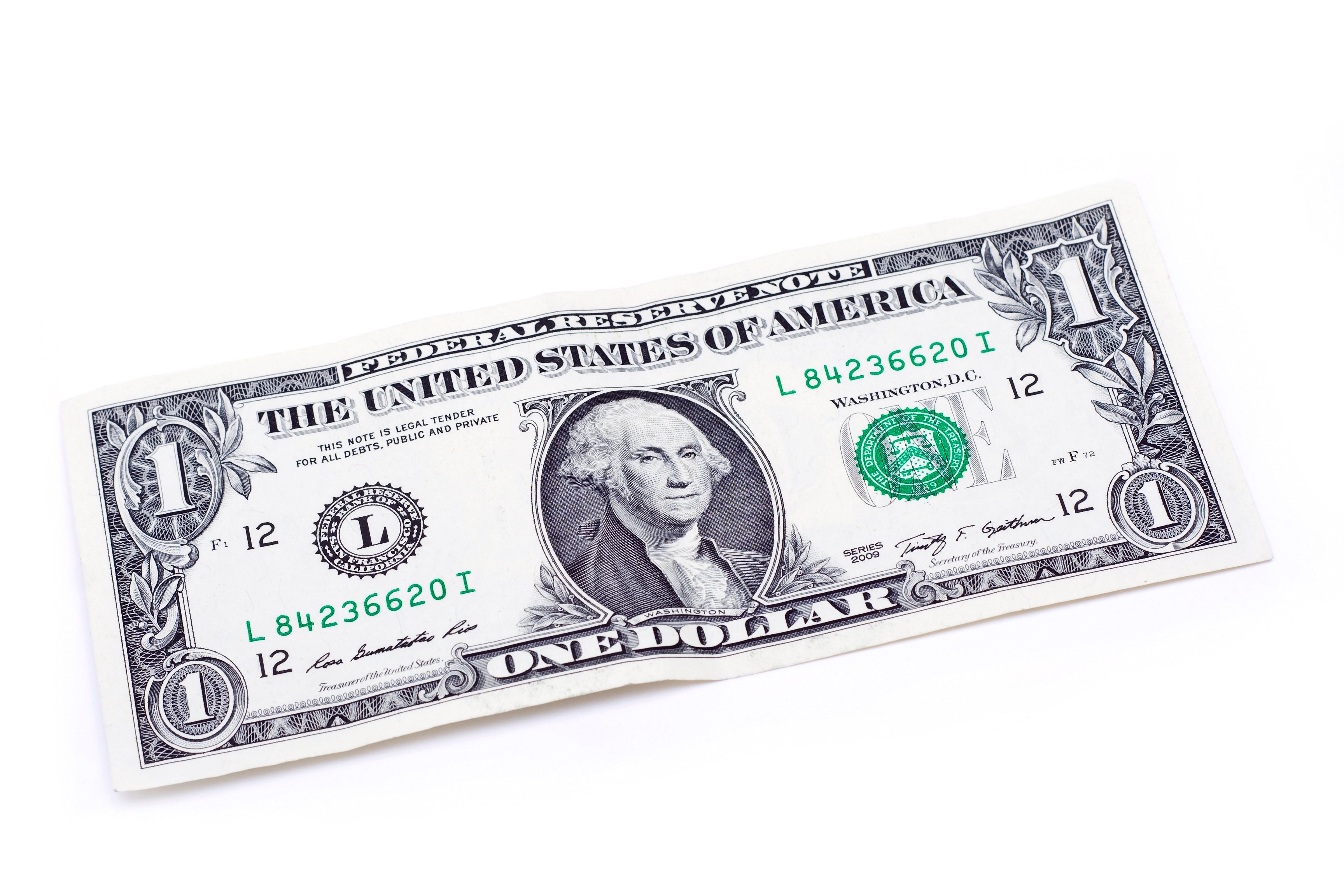 One dollar bill lying flat.