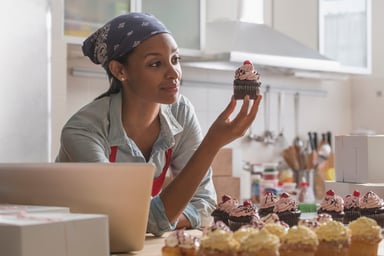 Woman Looking at Cupcake