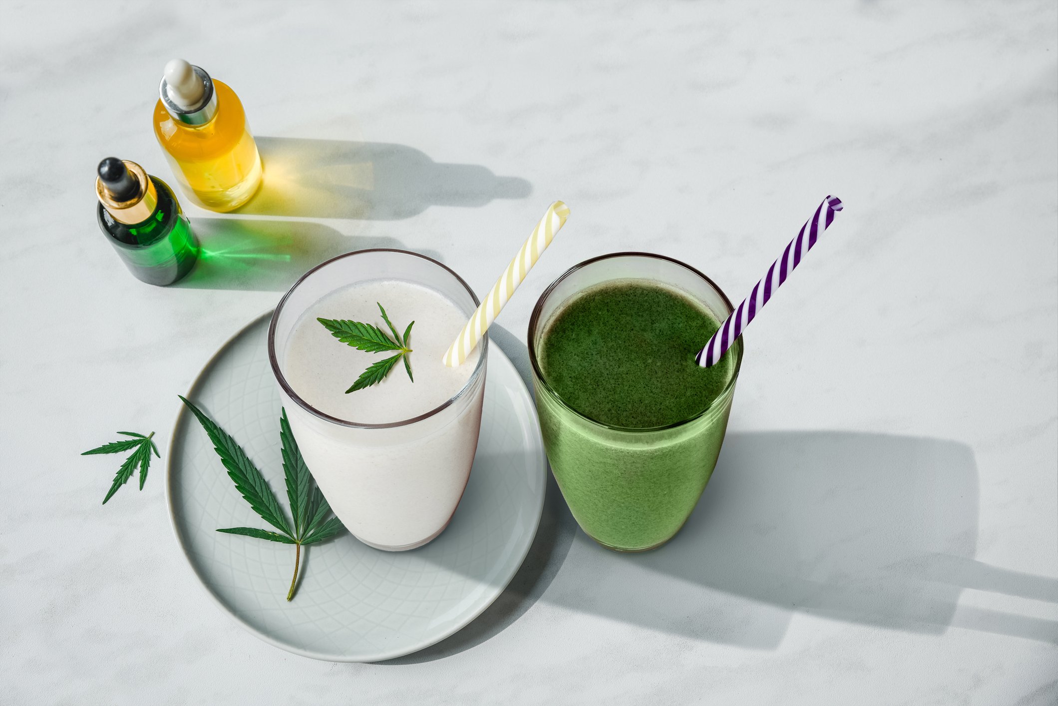 Green beverages with marijuana leaves
