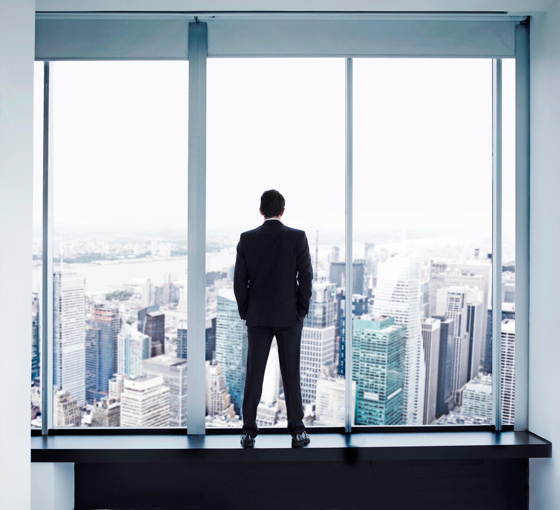 Executive looking out window