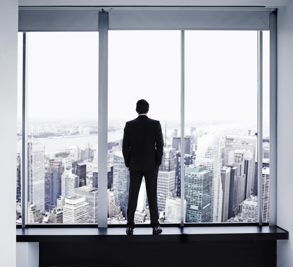 Executive looking out window