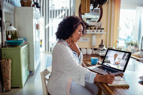 Woman seeing doctor over a virtual platform. 