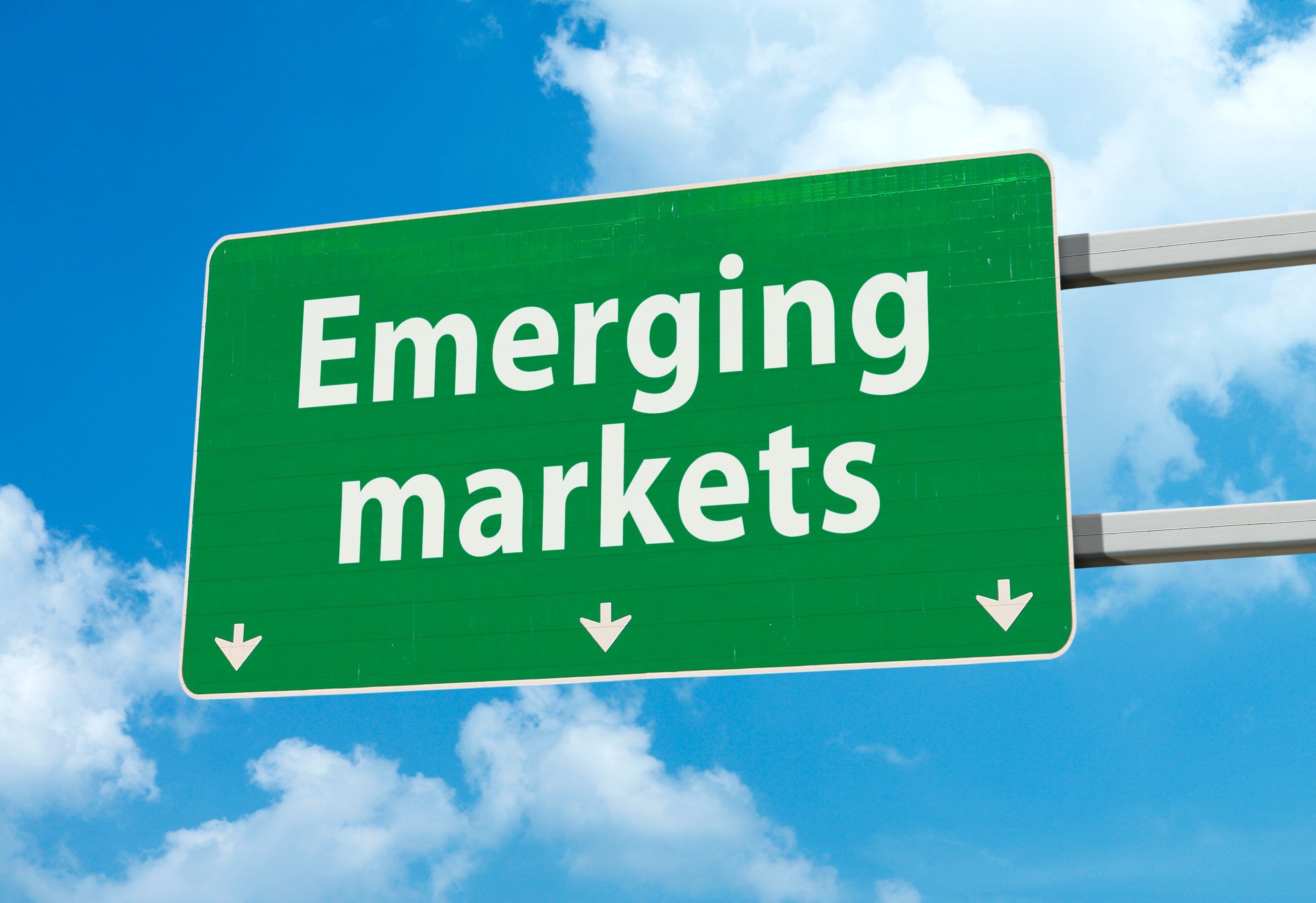 A highway sign that says "Emerging markets."