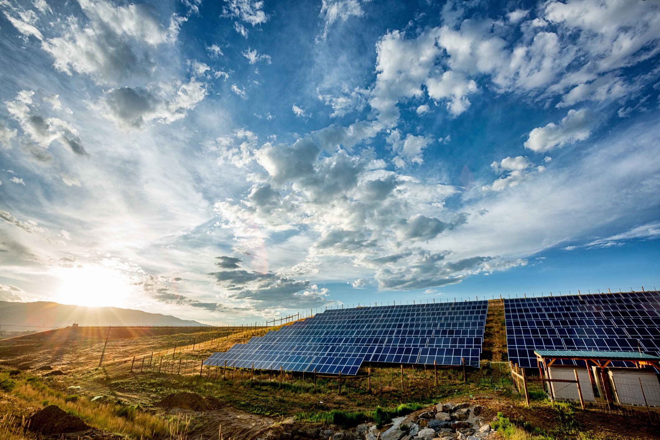 Solar panels under a cloudy sky. 