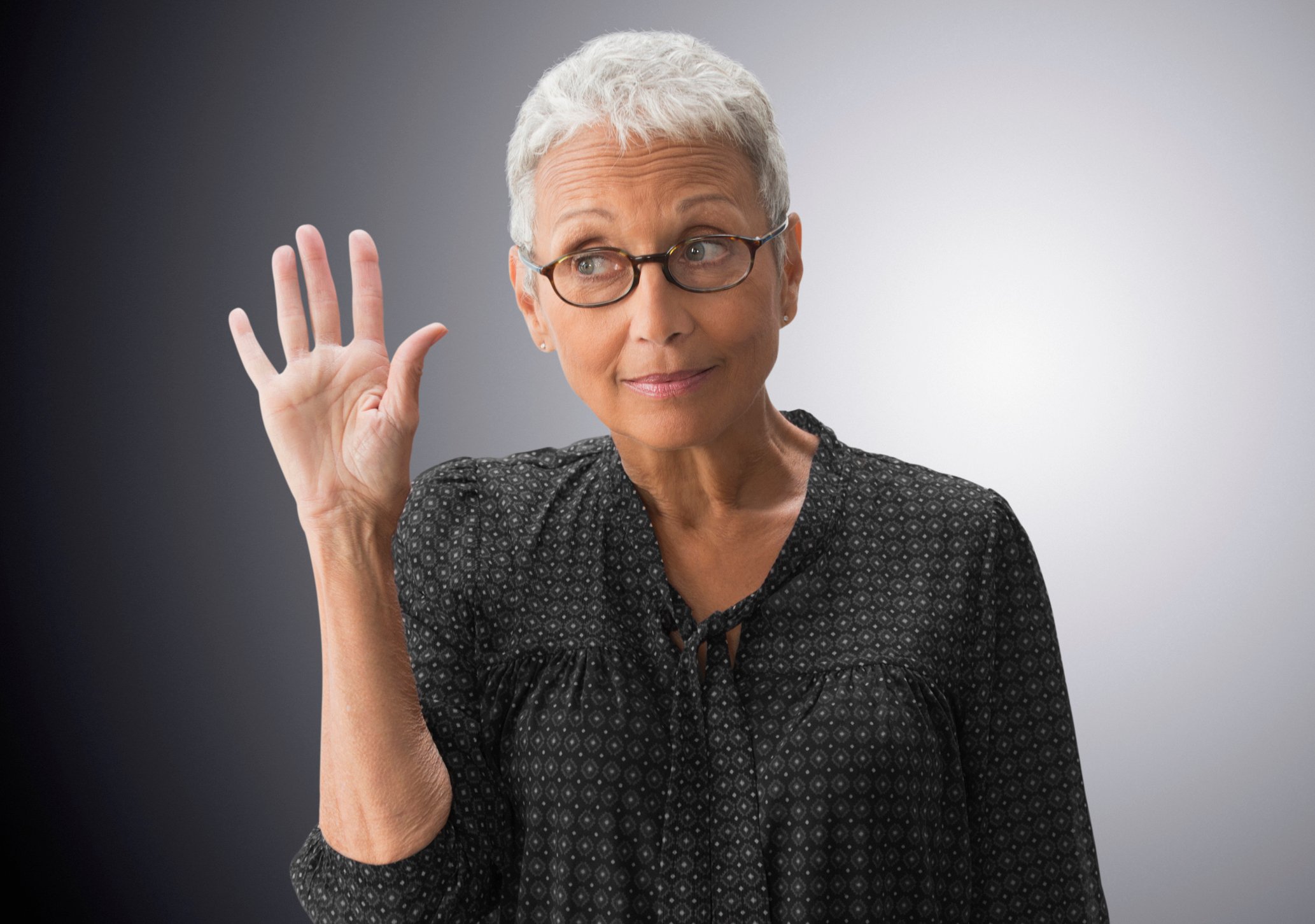 GettyImages-person raising hand with question