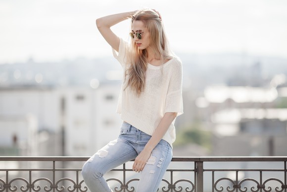 A woman wearing jeans.