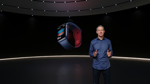 Jeff Williams at a virtual event in front of a blue Apple Watch Series 6