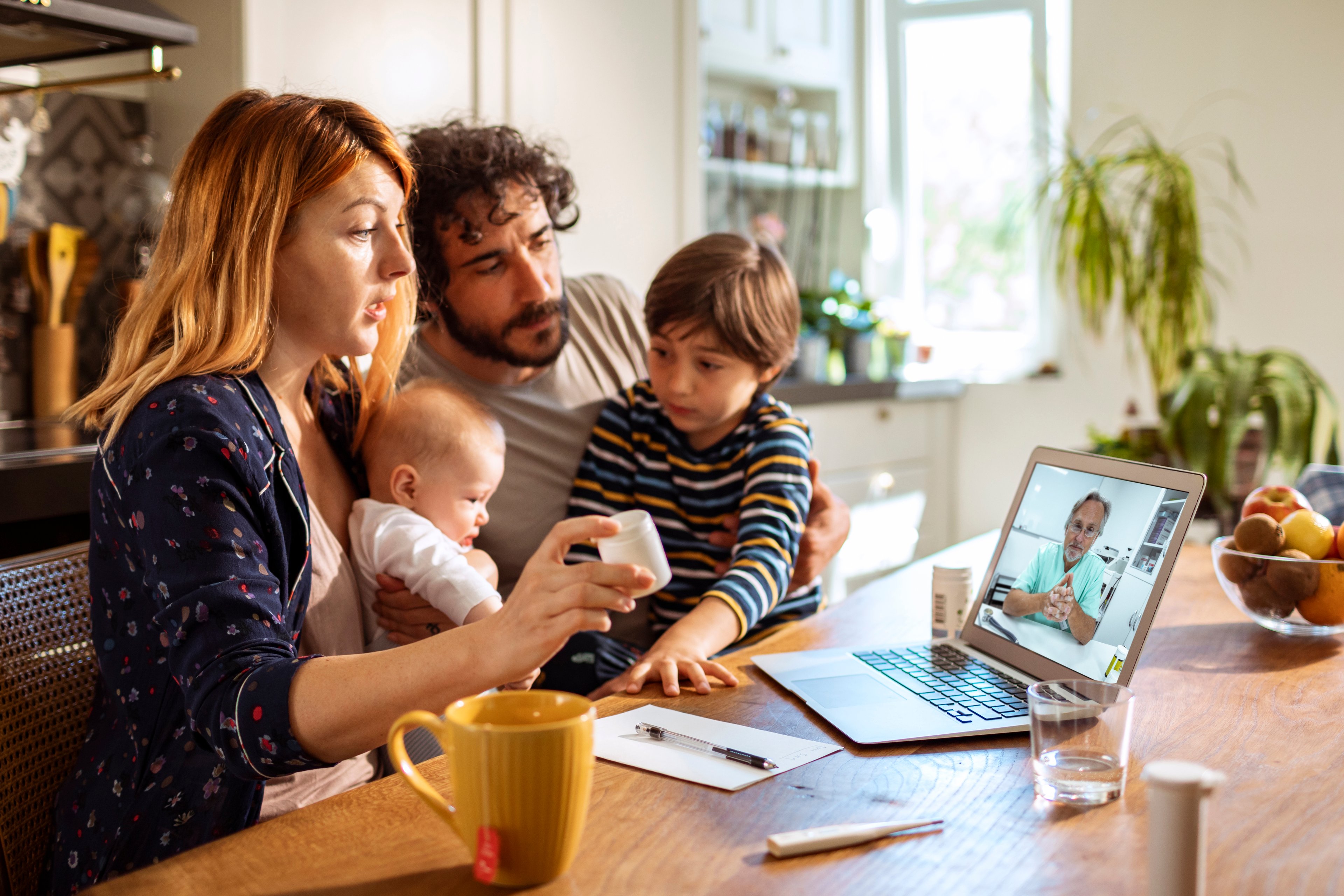 Family consulting with doctor over video chat. 