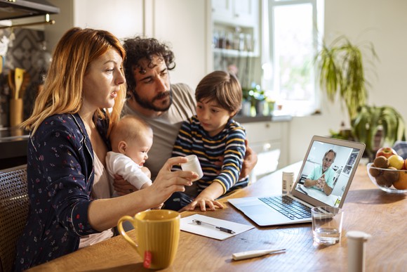 Family consulting with doctor over video chat. 
