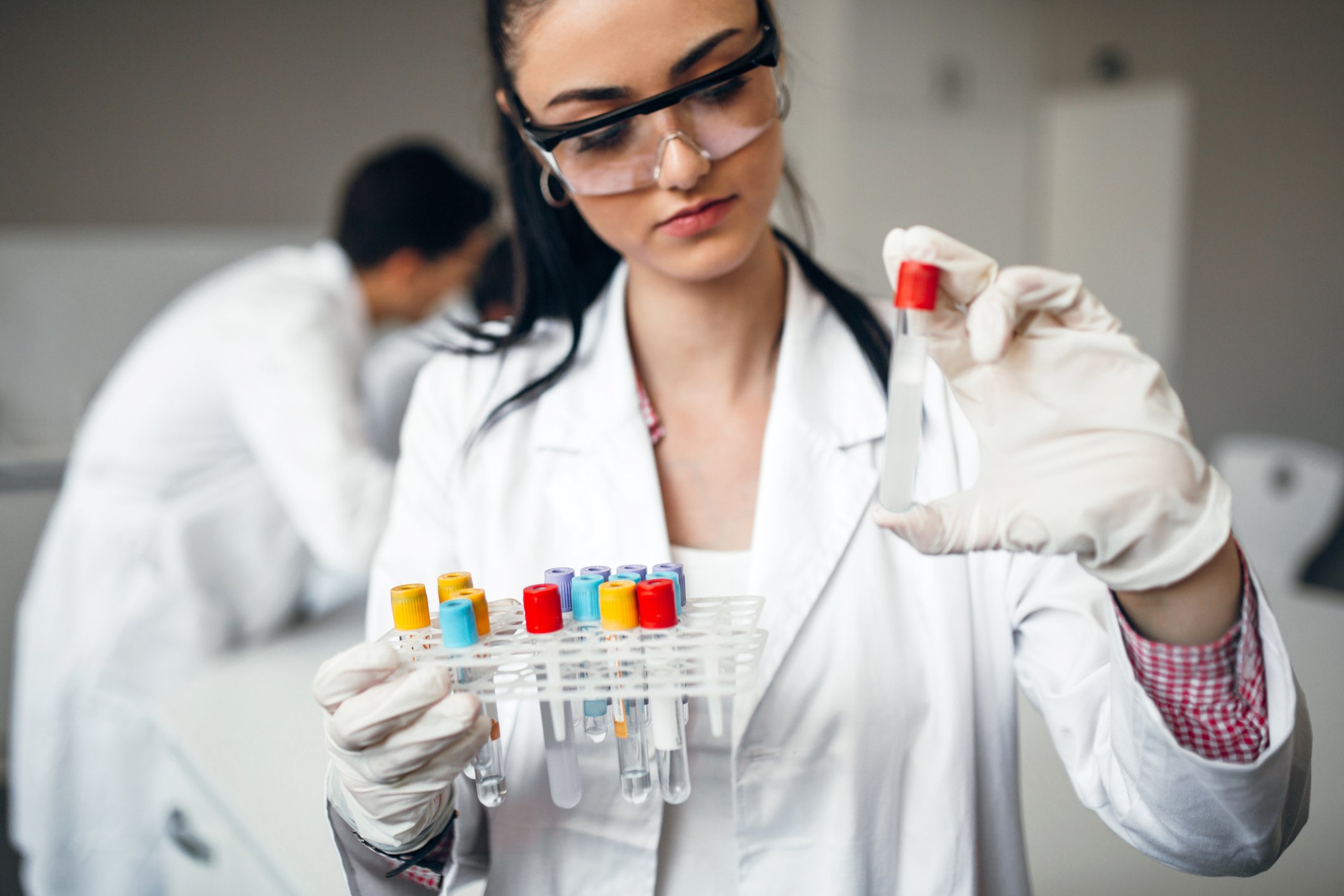 Scientist with a rack of sample tubes