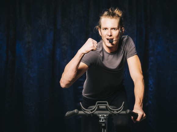 An activity leader on an exercise bike.