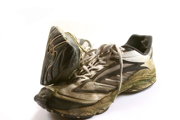 A pair of well-worn running shoes.