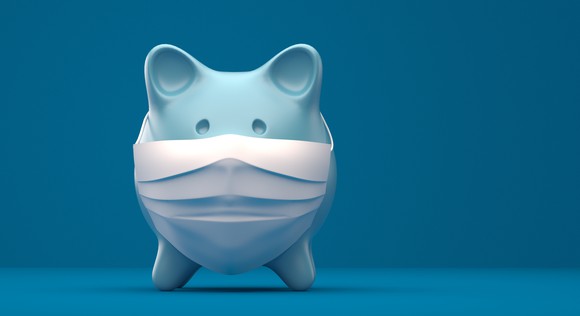 Piggy bank wearing a face mask.